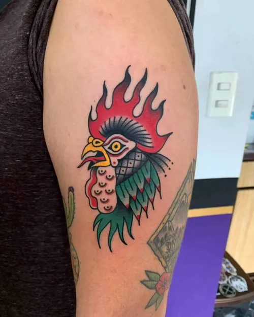 Traditionell tatuering av en tupp